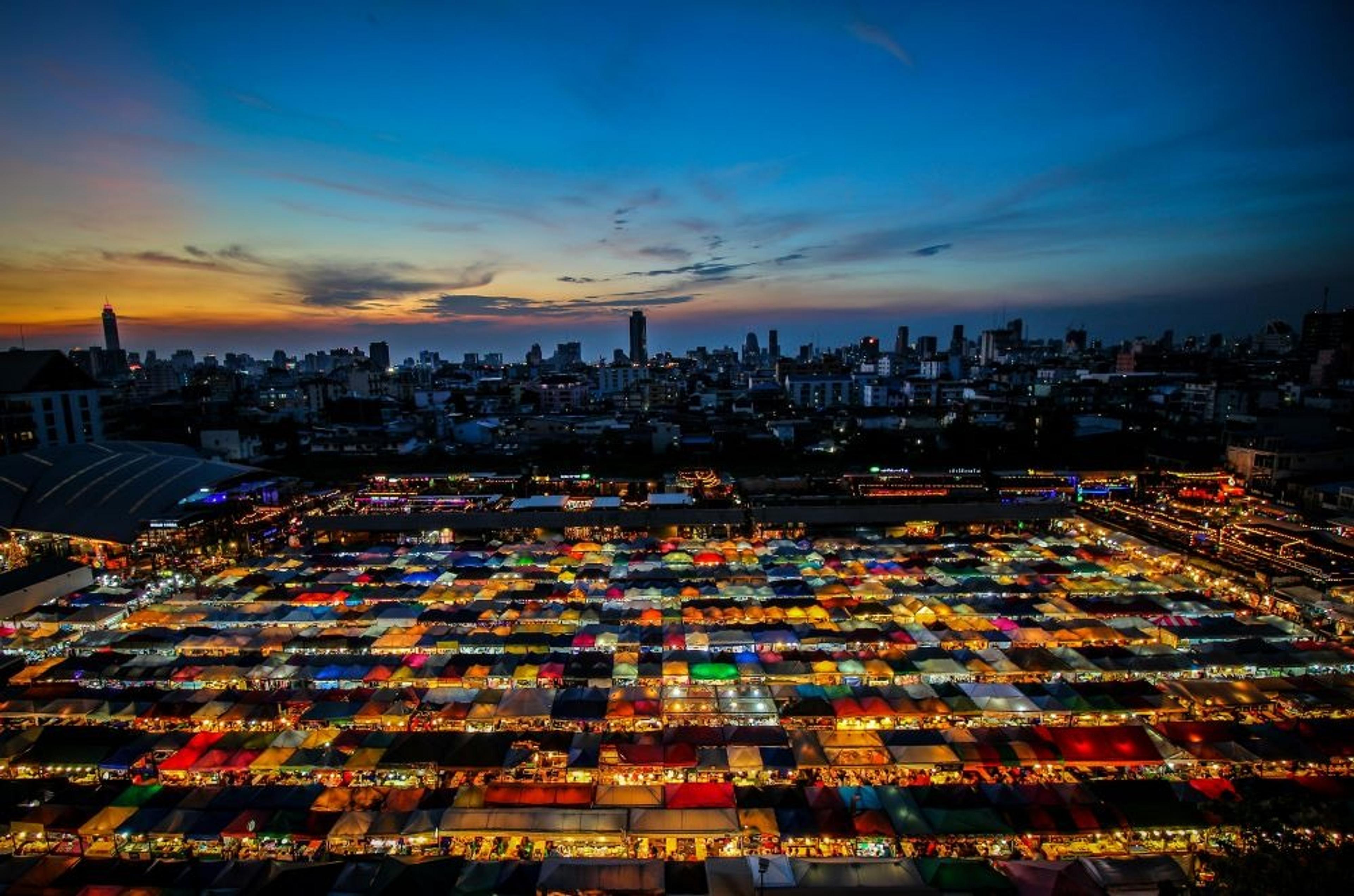 Bangkok night market stalls with colourful awnings