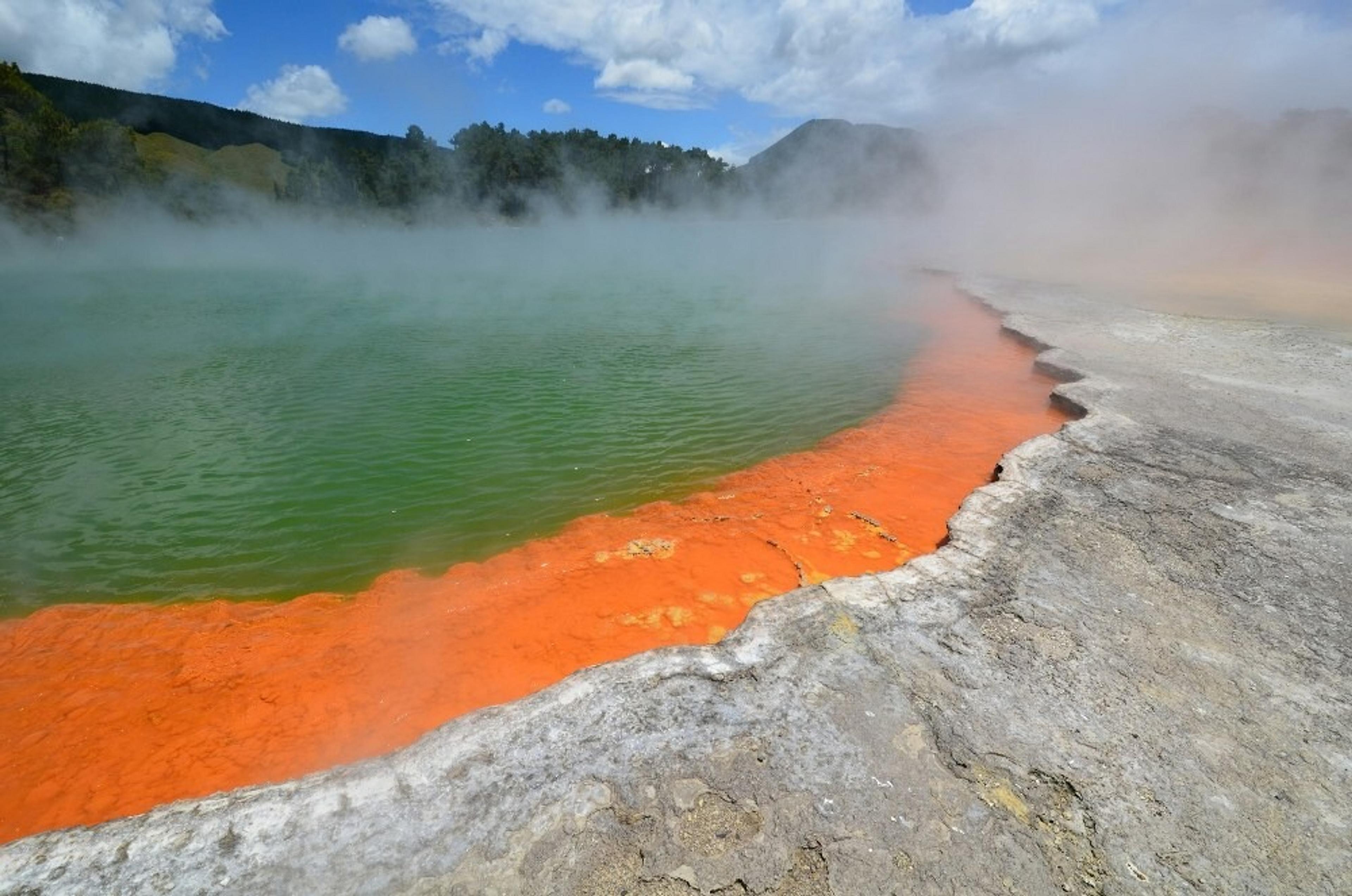 Sulfuric lake with steam rising