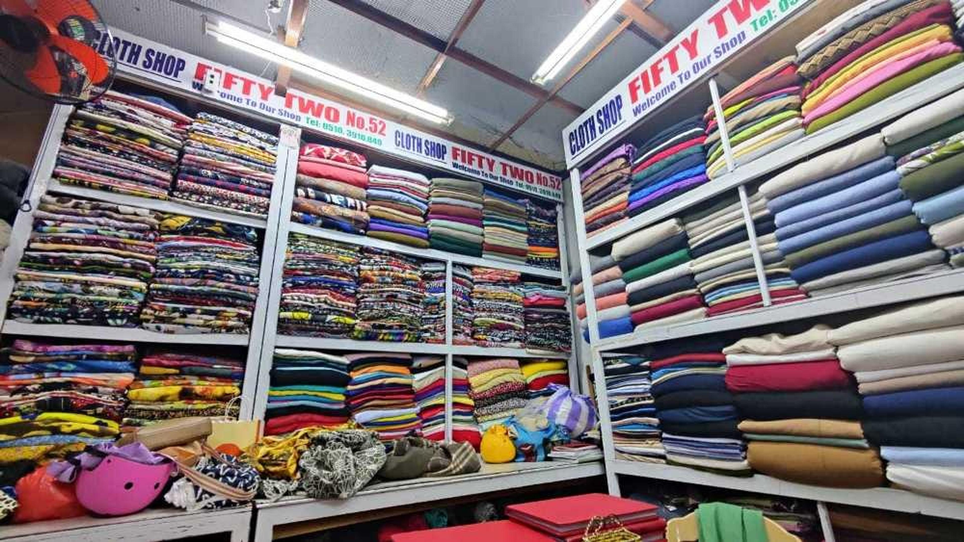 Walls piled high with fabrics